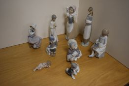 A group of three Lladro porcelain figures/studies, comprising a young Inuit child with polar bear