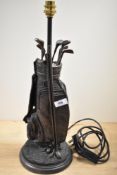A novelty bronze effect table lamp base, of golfing interest, measuring 53cm tall
