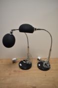 Two modern chrome and plastic angle poise lamps, 50cm tall