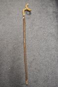 A vintage hazel walking stick having horn handle.