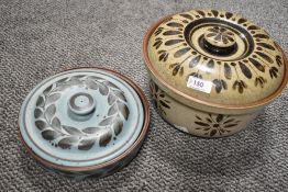 Two Ambleside pottery lidded casserole dishes.