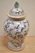 A 19th/20th Century Chinese polychrome lidded baluster vase, measuring 32cm tall