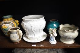 An Italian faience glazed vase, with lion mask handles, measuring 25cm tall, together with an
