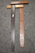 Two vintage wooden straight edges, One marked British Thornton.
