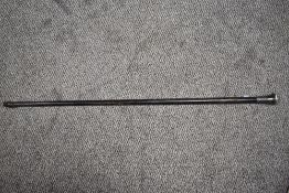 An antique walking cane, having Hallmarked silver handle with incised design.