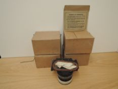 Four WWII British Gas Masks, some appear as new and some showing signs of age, all in original
