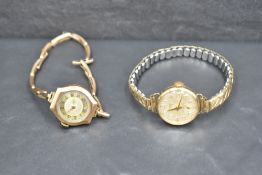 A vintage 9ct rose gold wrist watch having Arabic numeral dial to decorative face on a stretch strap