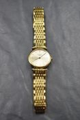 A gold plated wrist watch by Longines having baton numeral dial to champagne face in circular case