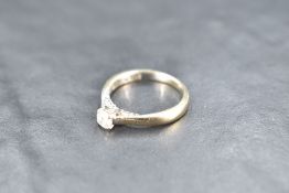 A diamond solitaire ring having diamond set mount, total approx 0.45ct in a 4 claw setting on an