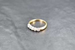 A five stone diamond half eternity ring, approx 0.45ct total on an 18ct gold loop, size O & approx