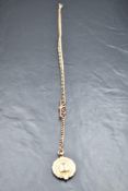 A 9ct rose gold watch chain with T bar and 9ct yellow gold medalion, approx 300mm & 37g