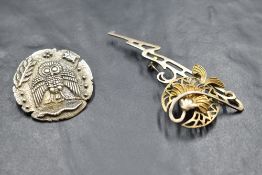 A silver brooch/pendant modelled as a Greek owl of wisdom after the mythological Athena owl, and a