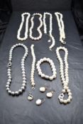 A black jewellery case containing a selection of baroque pearl necklaces