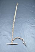 A 9ct rose gold watch Albert, having graduating curb type links, dog clasp, T-bar, marked 9 .375,