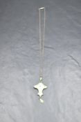 An Art Nouveau silver and enamel pendant having rose decoration on a fixed chain, Birmingham 1912, J