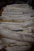 A collection of vintage and antique table linen, including some huckaback towels, a nightdress