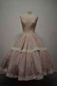 An incredibly full skirted 1950s Swiss dot sun dress, having tiered skirt with bands of Broderie