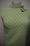 A 1960s two piece dress suit, having Kitty Copeland label and a green and white 1960s dress.