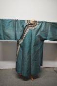 A 20th century oriental semi sheer jacket having brass button and loop fastening to side with
