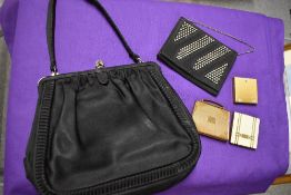 Two vintage evening bags and a trio of compacts, one monogrammed 'AB'.