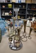 An early 20th Century epergne, measuring 40cm tall, two other silver plated epergnes, and an egg