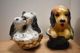 Two vintage chalkware carnival dog ornaments, the largest measures 29cm tall
