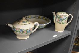 An Empire porcelain floral lustre coffee pot, a teapot of similar design, and a Crownford hand