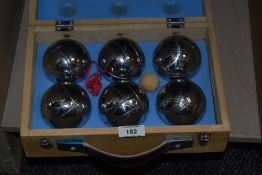 A cased set of six traditional French boules