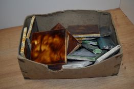 A selection of miscellaneous ceramic tiles, mainly mottled brown/ treacle glaze, marked MAWCO to