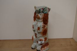 A Victorian Staffordshire pottery dog jug.