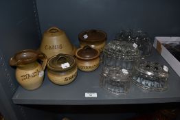 A collection of Tregaron pottery stoneware jars, jar names translate to; cheese, sugar, milk,