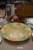 An Art Deco Falcon Ware bowl, a novelty treen rotating musical bowl, and a Vallee lustre vase