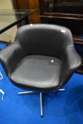 A vintage vinyl swivel chair