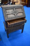 An early 20th century oak bureau of small proportions