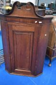A 19th Century oak corner cupboard