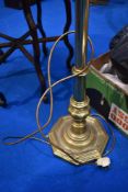 A traditional brass column standard lamp
