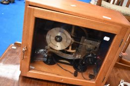A vintage cased electric timing calendar clock , possibly a regulator having smiths self starting