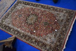 A fine Oriental silk rug, having red foliate ground, approx. 155 x 95cm