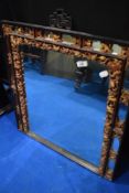 An Oriental style wall mirror