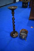 An early to mid 20th Century torchere having open twist column and a copper planter