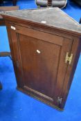 A 19th Century oak corner cupboard of smaller proportions