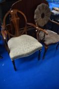 Two early 20th Century mahogany and upholstered armchairs (not a pair)