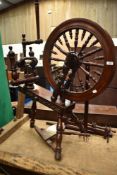 A traditional mahogany spinning wheel