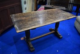 A traditional oak refectory style dining table