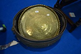A brass planter and table top
