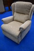 A modern manual recliner , in cream