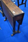 A Victorian mahogany Sutherland table having inlaid top turned legs