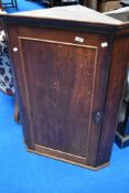 A 19th Century oak corner cupboard