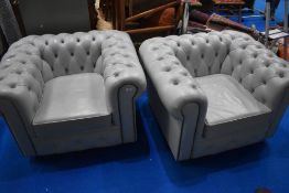 A pair of modern Chesterfield style button back grey leather easy chairs