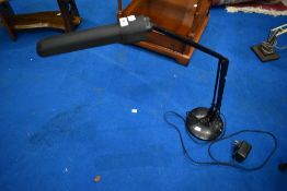 A vintage style anglepoise worklight